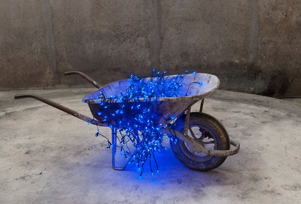 Sislej Xhafa, Rocket Ship, 2011, wheelbarrow, blue light strings 60 x 150 x 65 cm